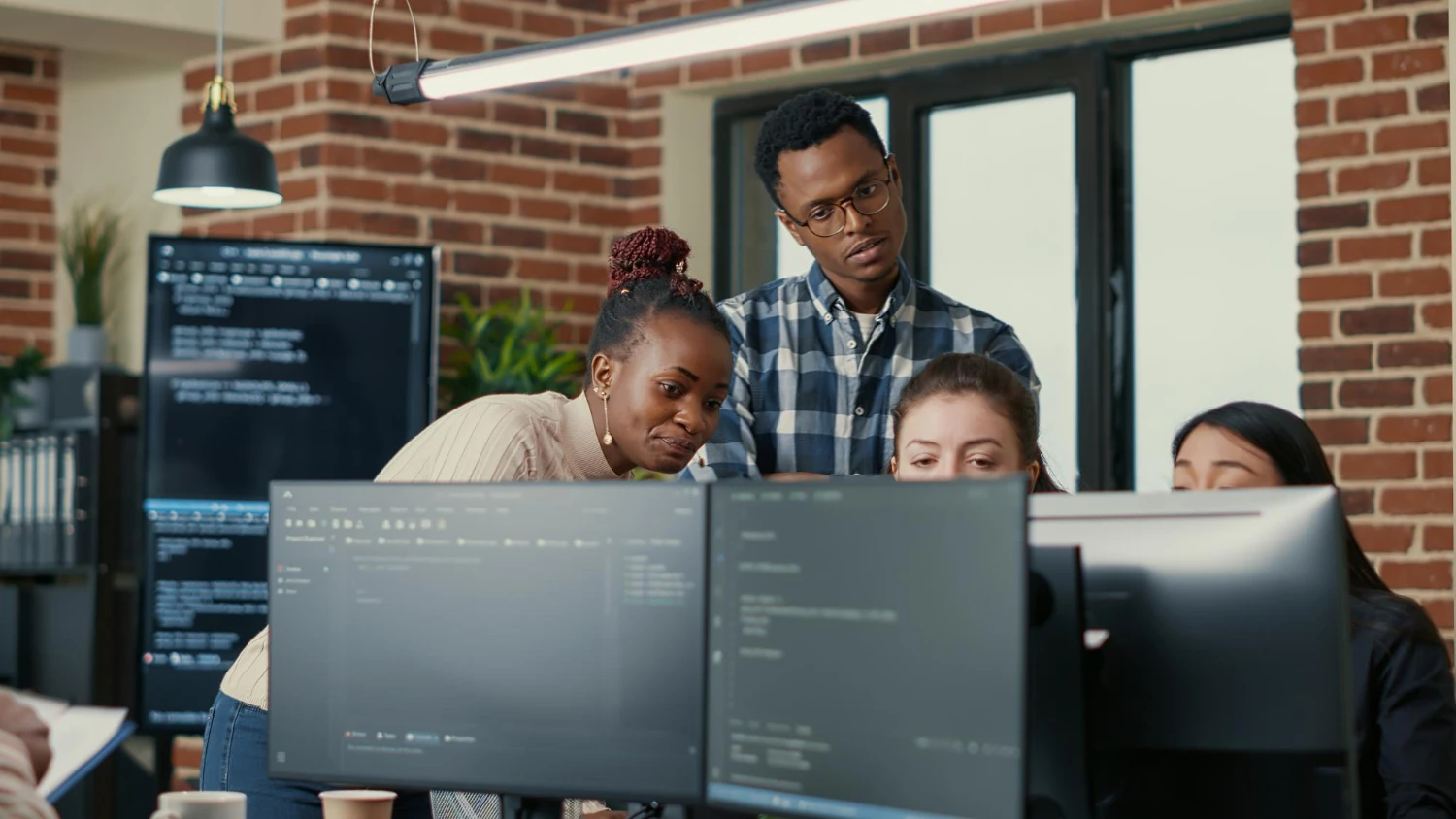 Technology team collaborating around a table